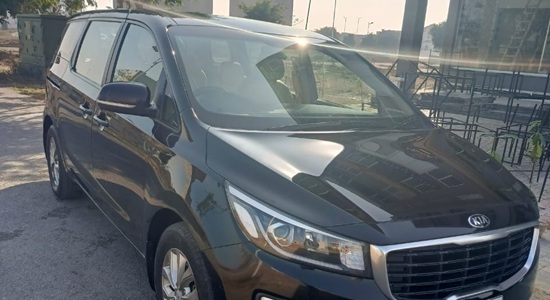 Front - Kia Grand Carnival Rent a Car